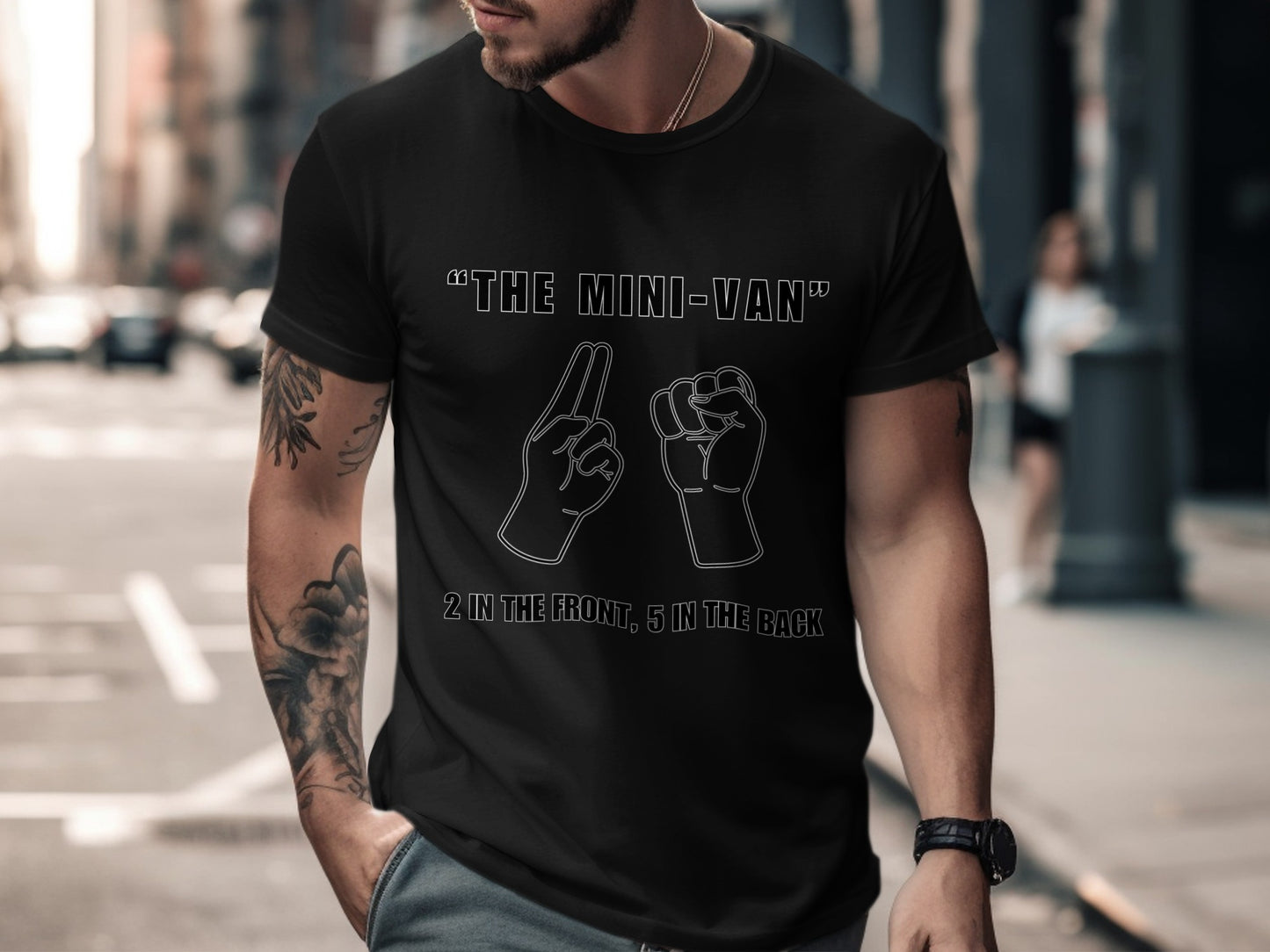 Black t-shirt with "The Mini-Van" and hand drawings.