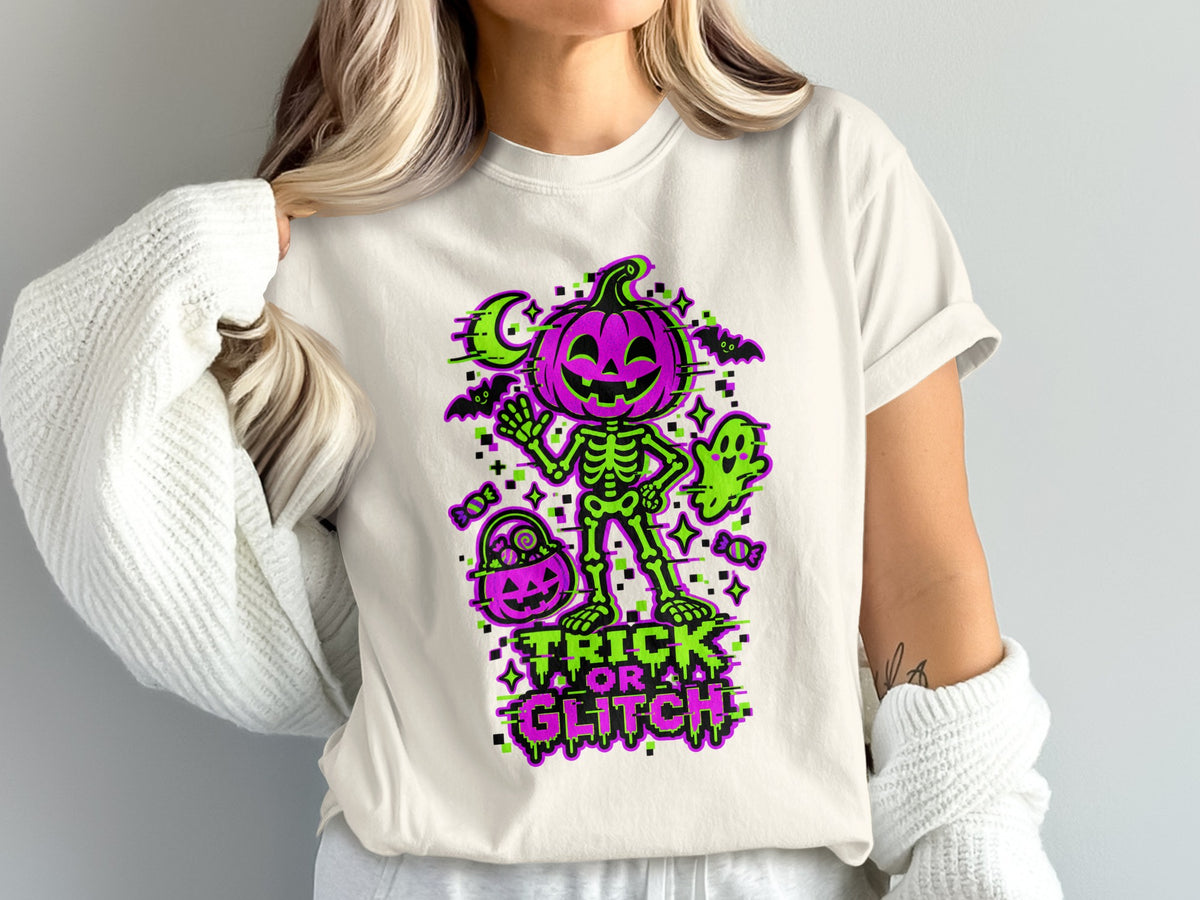 Skeleton pumpkin with ghost and bats on a shirt with "Trick or Glitch" text.