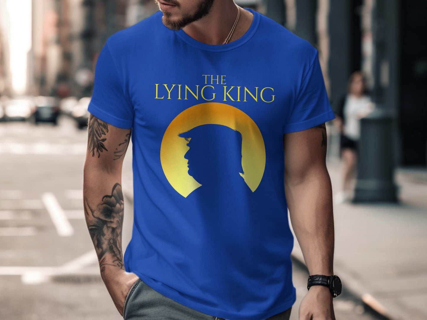 Blue t-shirt with yellow text "THE LYING KING" and Donald Trump silhouette.