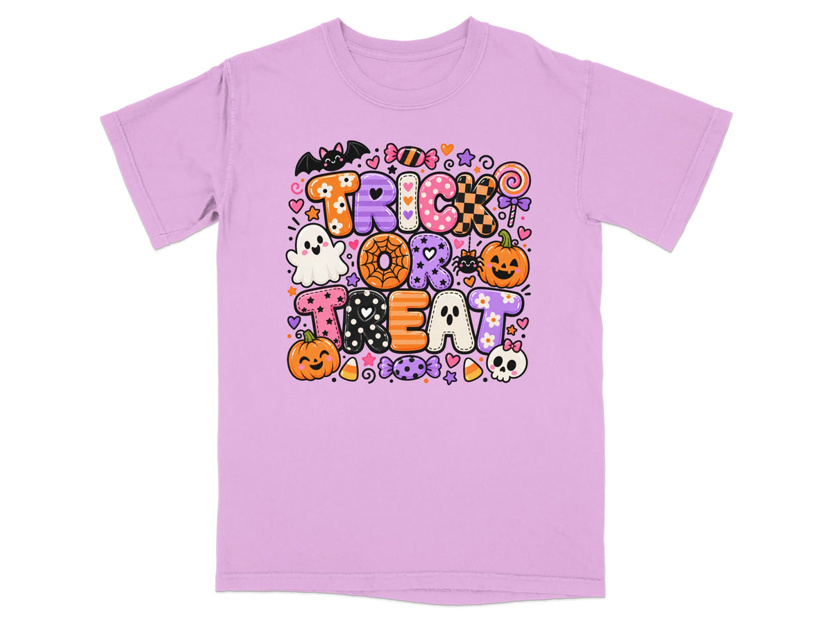 Lilac t-shirt with "Trick or Treat" Halloween graphic featuring candy, pumpkins, and ghosts.