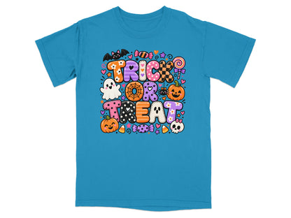 Teal t-shirt with Halloween "Trick or Treat" text and cartoon icons.