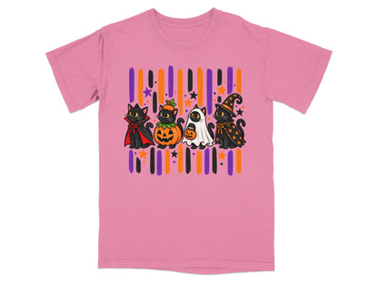 Four cartoon cats in Halloween costumes: vampire, pumpkin, ghost, and witch, on pink shirt.
