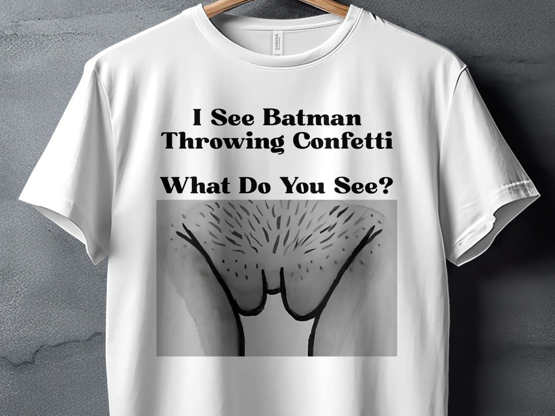 White t-shirt with text "I See Batman Throwing Confetti What Do You See?" and a graphic.