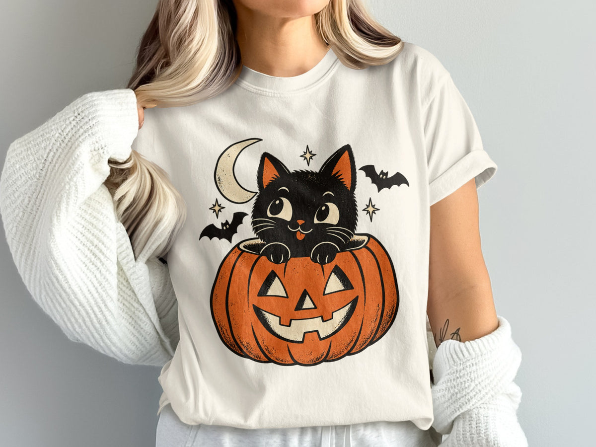Black cat peeking out of jack-o-lantern with moon and bats.