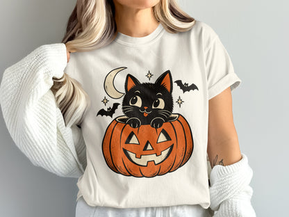 Black cat peeking out of jack-o-lantern with moon and bats.