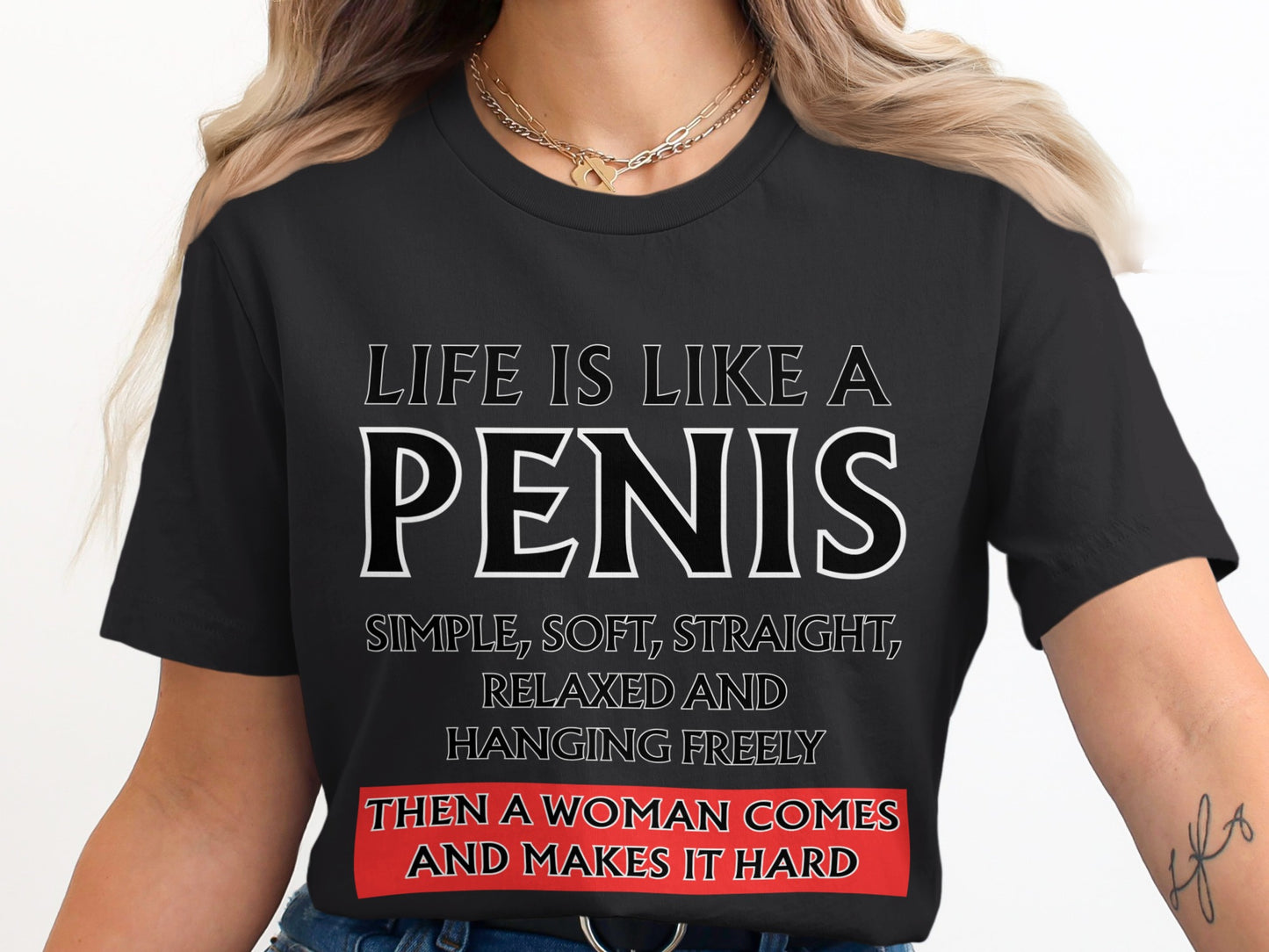 Black t-shirt with text: "Life is like a penis, simple, soft, straight, relaxed and hanging freely, then a woman comes and makes it hard."