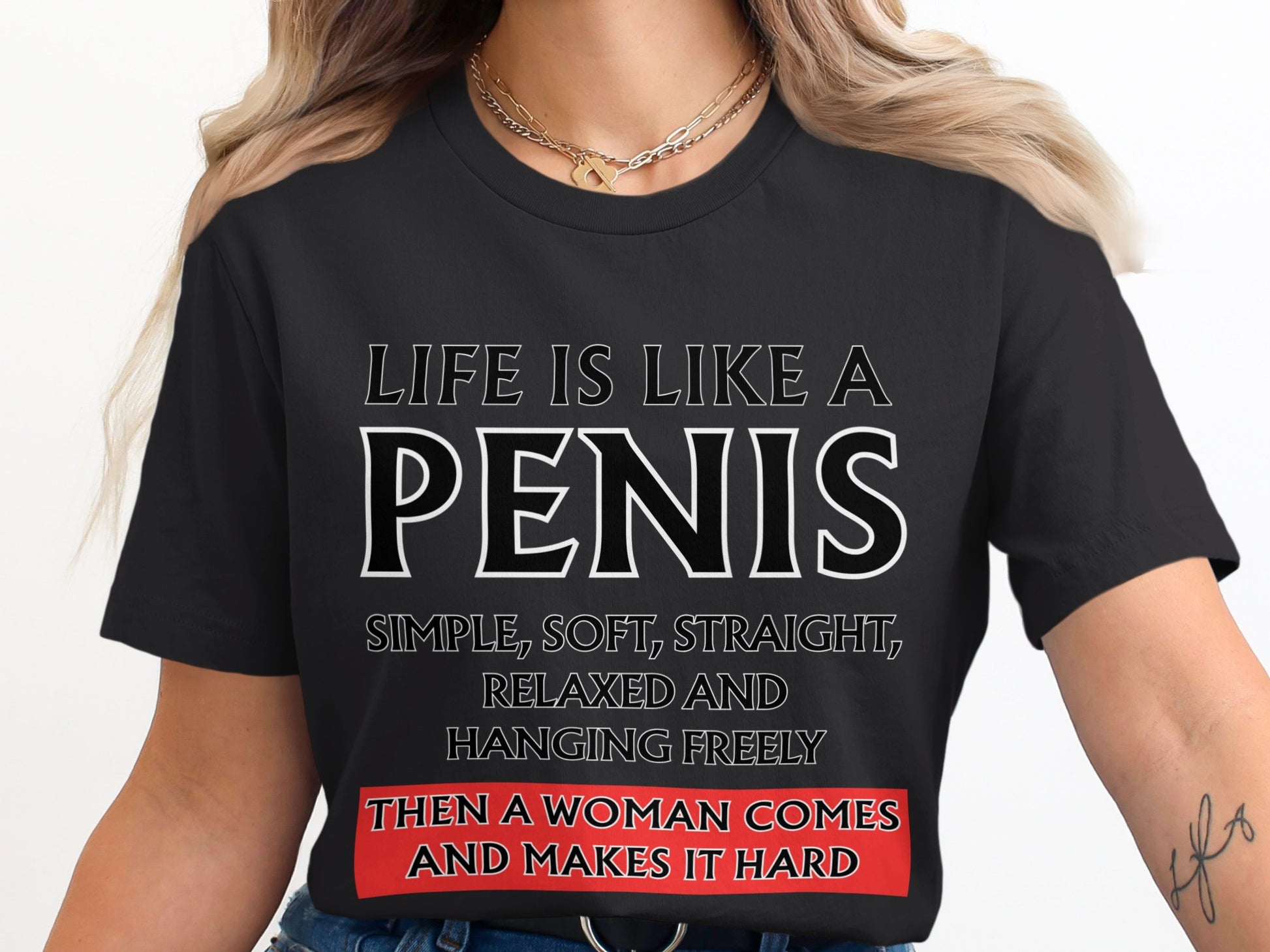 Black t-shirt with text: "Life is like a penis, simple, soft, straight, relaxed and hanging freely, then a woman comes and makes it hard."