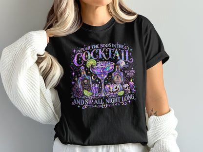 Black t-shirt with Halloween cocktail graphic and text "Pour the boos in the cocktail and sip all night long."
