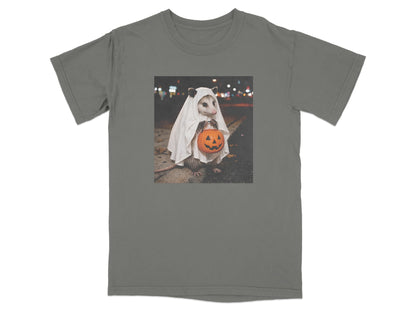 Opossum in ghost costume holding a jack-o'-lantern candy bucket.