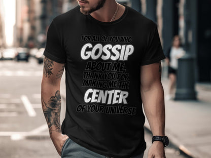 Black t-shirt with text: "GOSSIP ABOUT ME, THANK YOU FOR MAKING ME THE CENTER OF YOUR UNIVERSE."