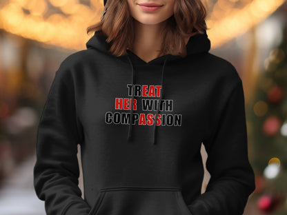 Black hoodie with "TREAT HER WITH COMPASSION" text.