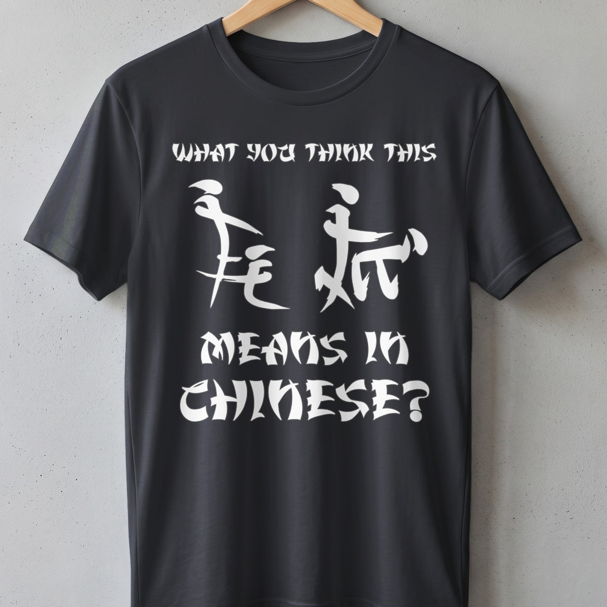 Dark grey t-shirt with white text and Chinese characters reading "WHAT YOU THINK THIS MEANS IN CHINESE?".