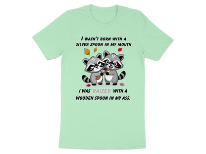 Two raccoons share a wooden spoon; text reads "I WASN'T BORN WITH A SILVER SPOON IN MY MOUTH".