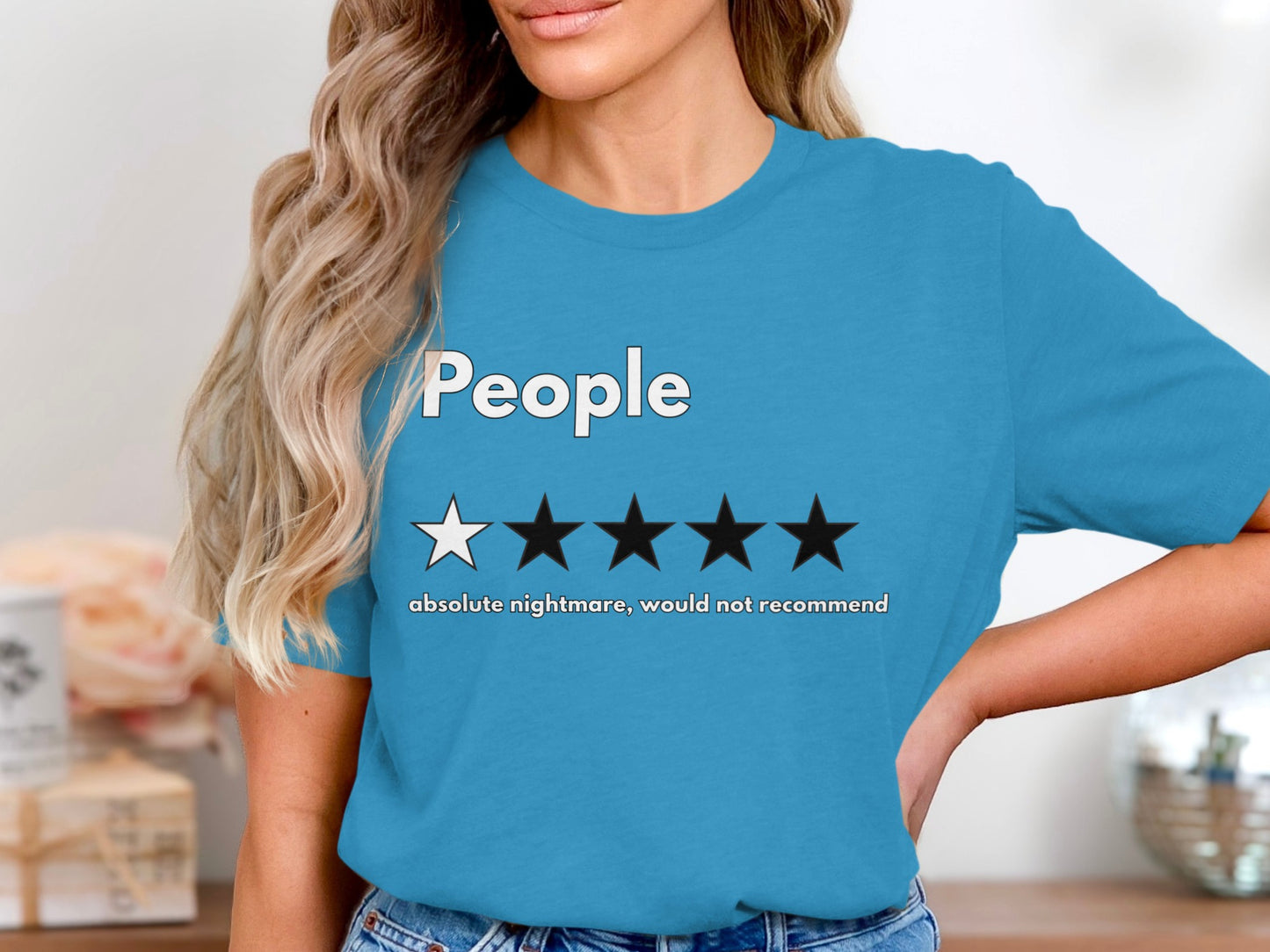 Blue t-shirt with "People" text, one white star, four black stars, and "absolute nightmare, would not recommend" text.