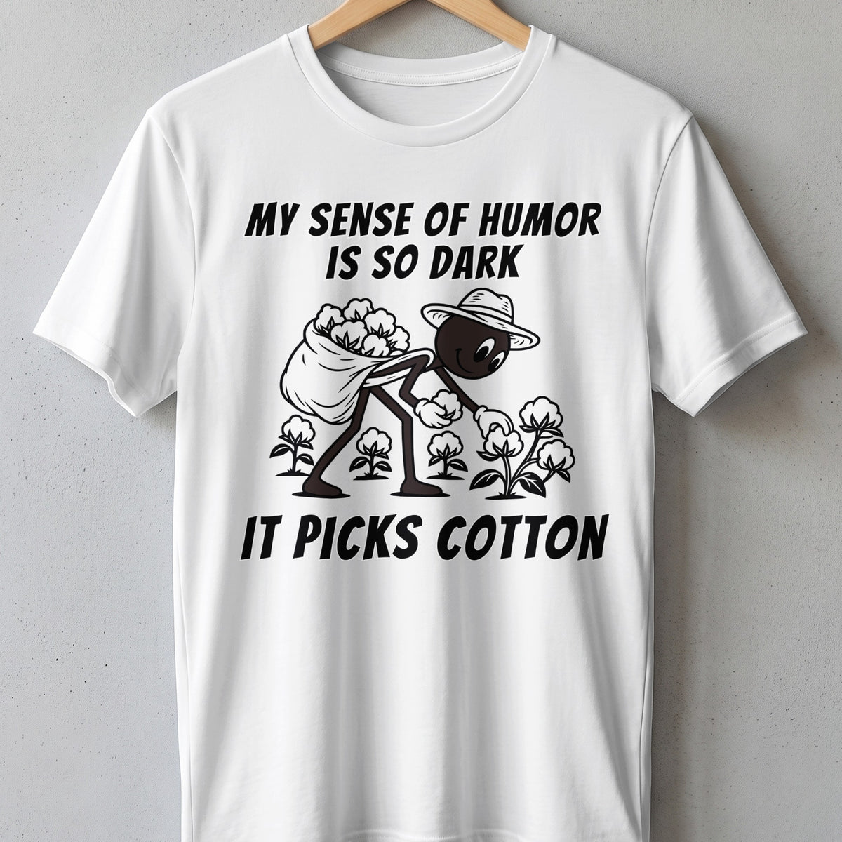White t-shirt with black text "MY SENSE OF HUMOR IS SO DARK IT PICKS COTTON".