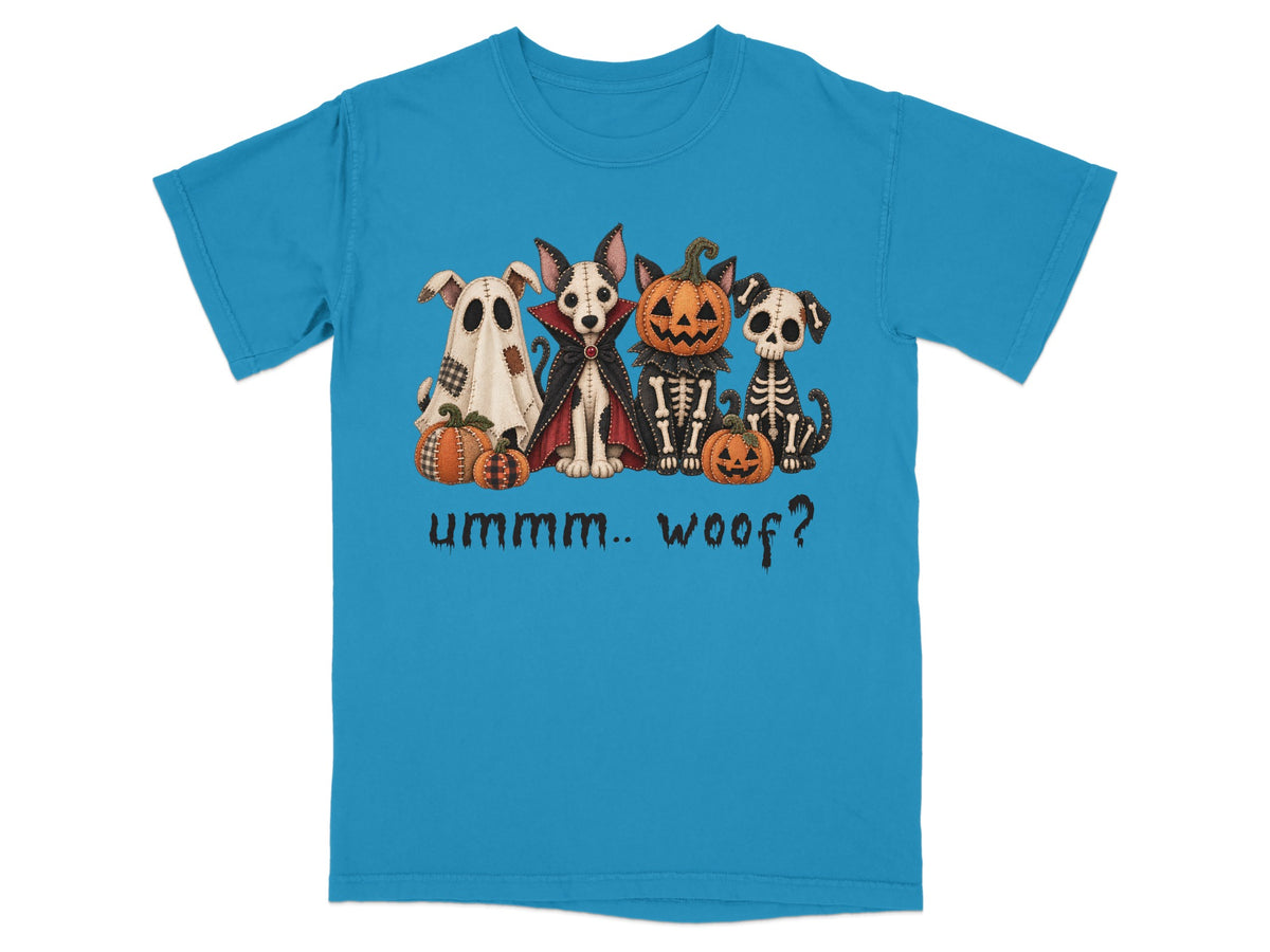 Halloween dogs dressed as a ghost, vampire, skeleton, and pumpkin on a blue shirt.