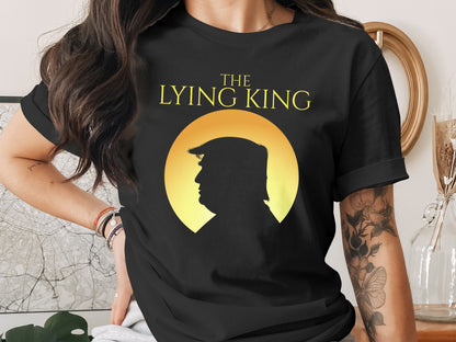 Black t-shirt with yellow text "The Lying King" above silhouette of Donald Trump.