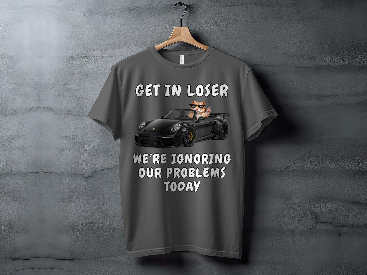 Gray t-shirt with text "GET IN LOSER" and a cat in a convertible ignoring problems.