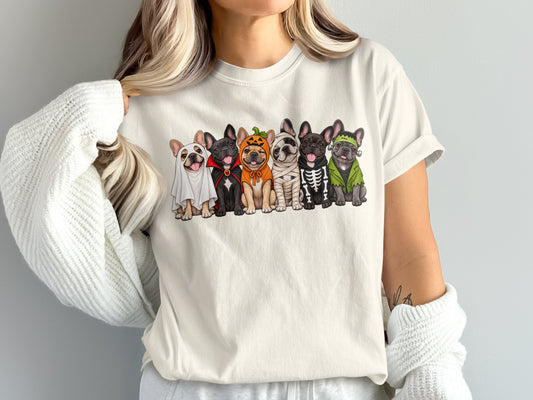 French Bulldogs dressed as ghosts, vampires, pumpkin, mummy, skeleton, and Frankenstein on a t-shirt.
