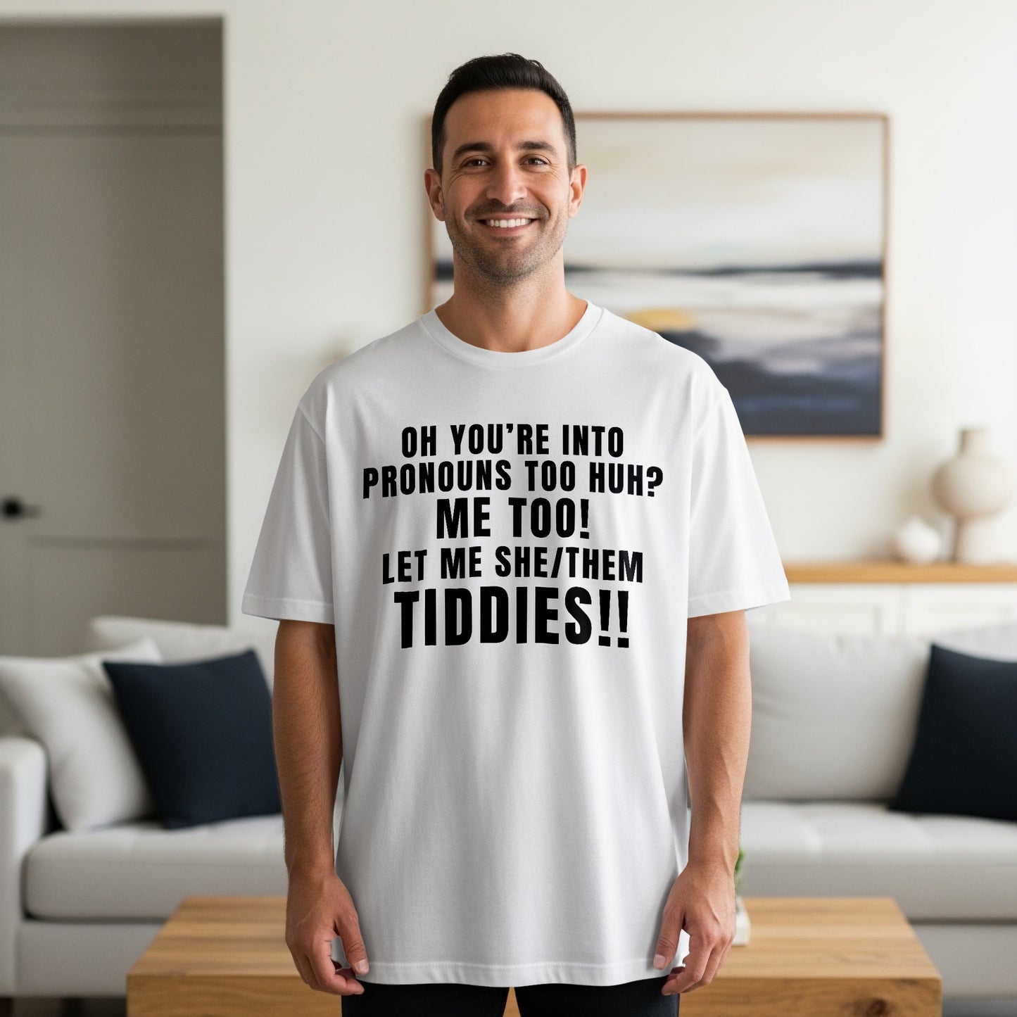 White t-shirt with black text: "OH YOU'RE INTO PRONOUNS TOO HUH? ME TOO! LET ME SHE/THEM TIDDIES!!"