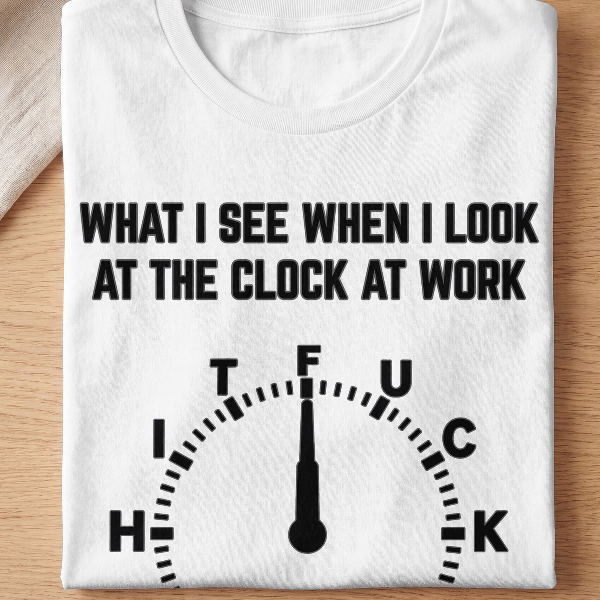 White t-shirt with black text and a clock graphic reading "What I see when I look at the clock at work."