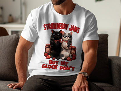 White t-shirt with cats holding guns and text "Strawberry Jams But My Glock Don't".