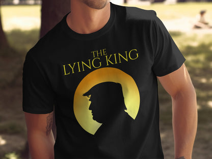 Black t-shirt with yellow text "THE LYING KING" and a silhouette of a man's head.