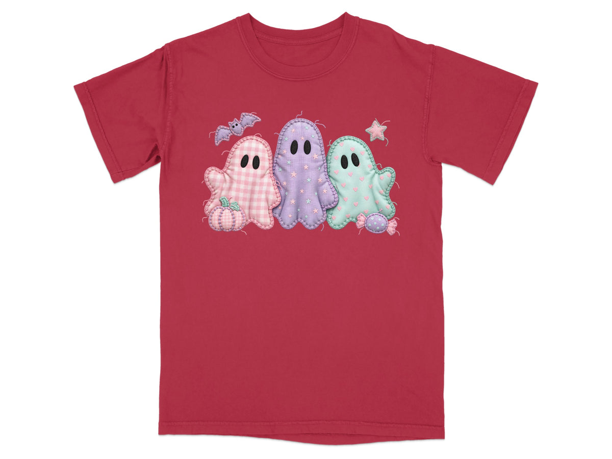 Red t-shirt with a pastel ghost Halloween applique and a pumpkin.