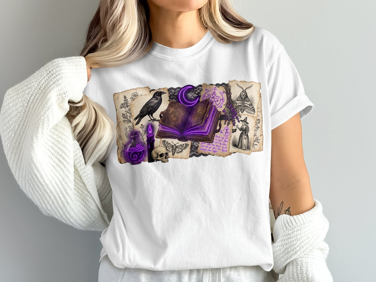 White t-shirt with a collage of vintage witchcraft imagery including a crow and spellbook.