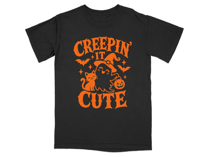 Black t-shirt with orange "Creepin' It Cute" Halloween graphic and ghost.