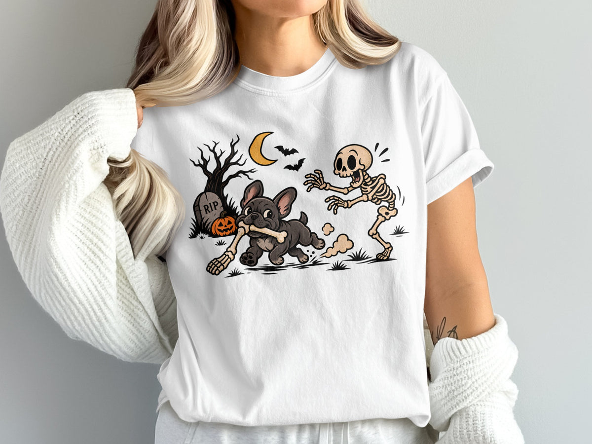 Skeleton chasing French bulldog carrying a bone on Halloween night.