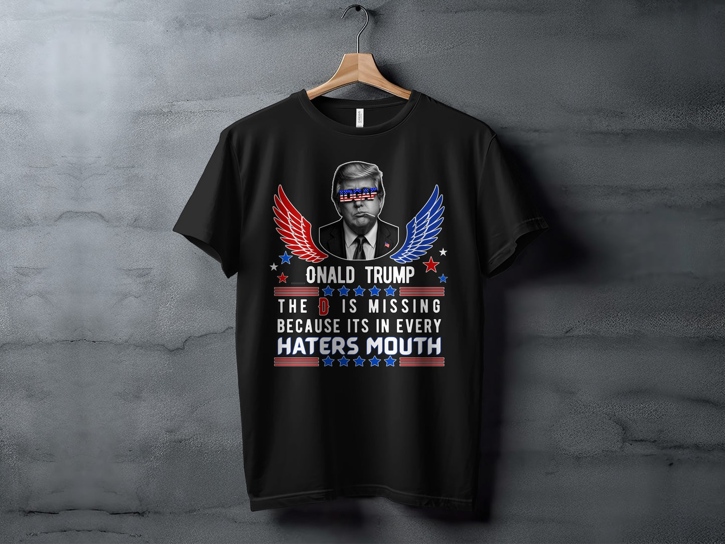 Black t-shirt with Donald Trump graphic and text "DONALD TRUMP THE D IS MISSING BECAUSE ITS IN EVERY HATERS MOUTH".