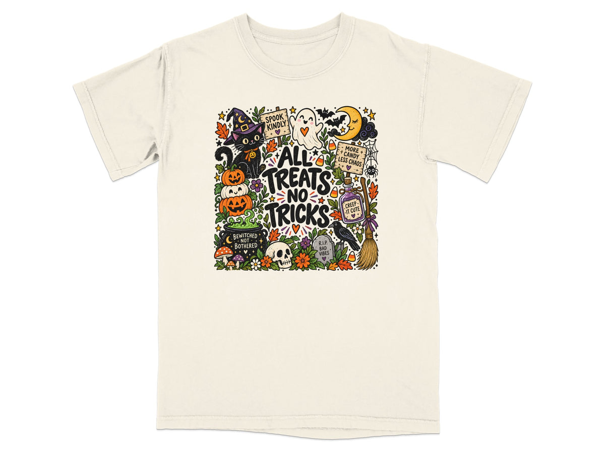Cream t-shirt with "All Treats No Tricks" Halloween graphic featuring a black cat, ghost, pumpkins, and moon.