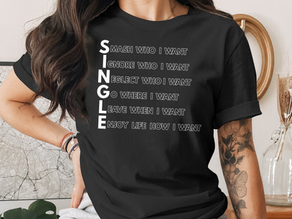 Black t-shirt with white text "SINGLE" followed by empowering phrases.
