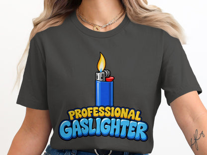 Dark gray t-shirt with a blue lighter and "Professional Gaslighter" text graphic.