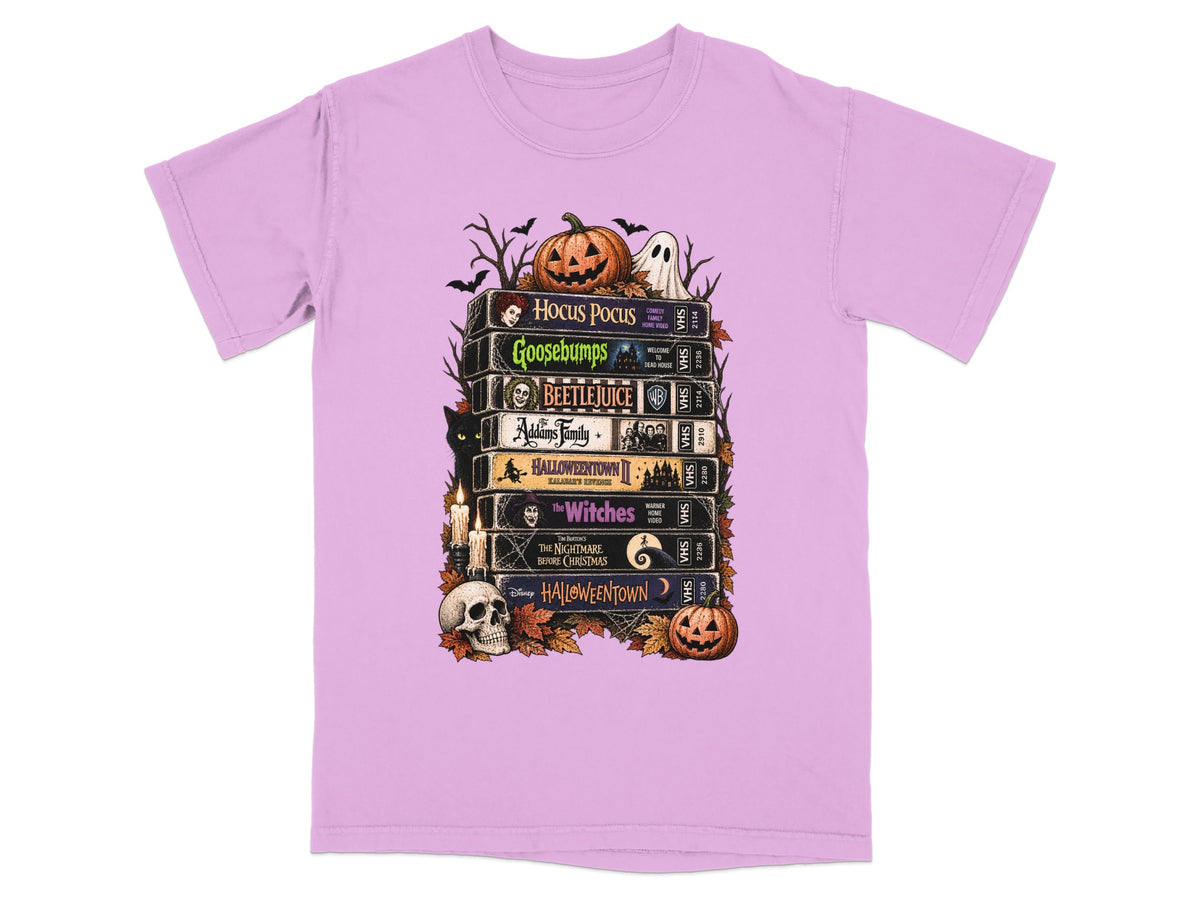 Halloween movie VHS stack with pumpkin, ghost, cat, and skull.