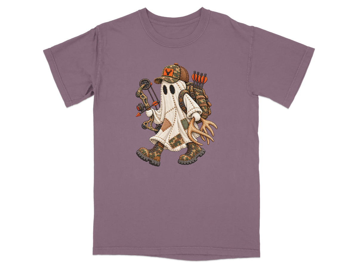 A mauve t-shirt with a graphic of a ghost holding a bow and arrow, wearing camo boots and a matching cap.
