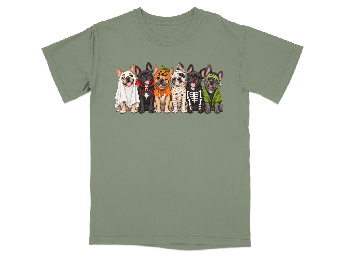 A green crewneck t-shirt featuring an illustration of six French bulldogs in various Halloween costumes.