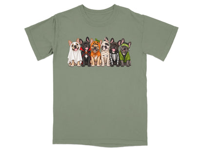 A green crewneck t-shirt featuring an illustration of six French bulldogs in various Halloween costumes.