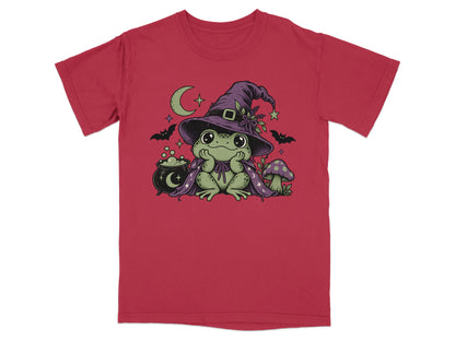 Red short-sleeve t-shirt featuring a graphic of a green frog wearing a witch hat and cape.