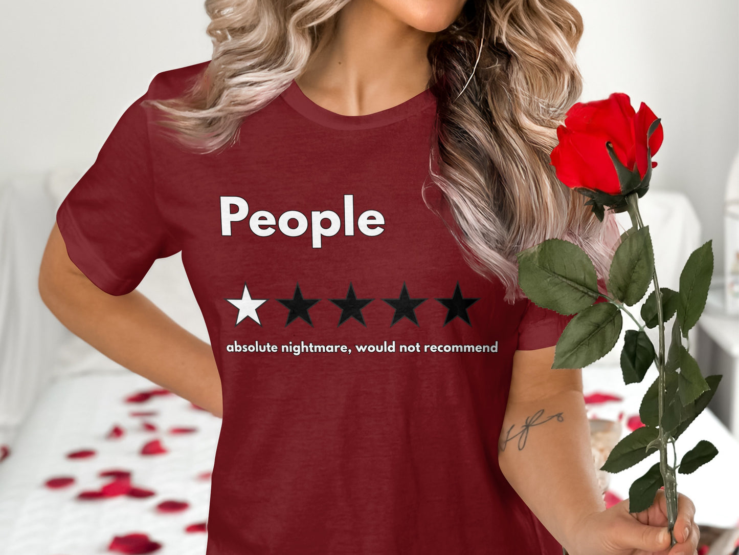 Maroon t-shirt with "People" text, one star, and "absolute nightmare, would not recommend"