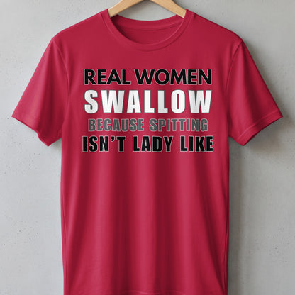 Red t-shirt with text "REAL WOMEN SWALLOW BECAUSE SPITTING ISN'T LADY LIKE".
