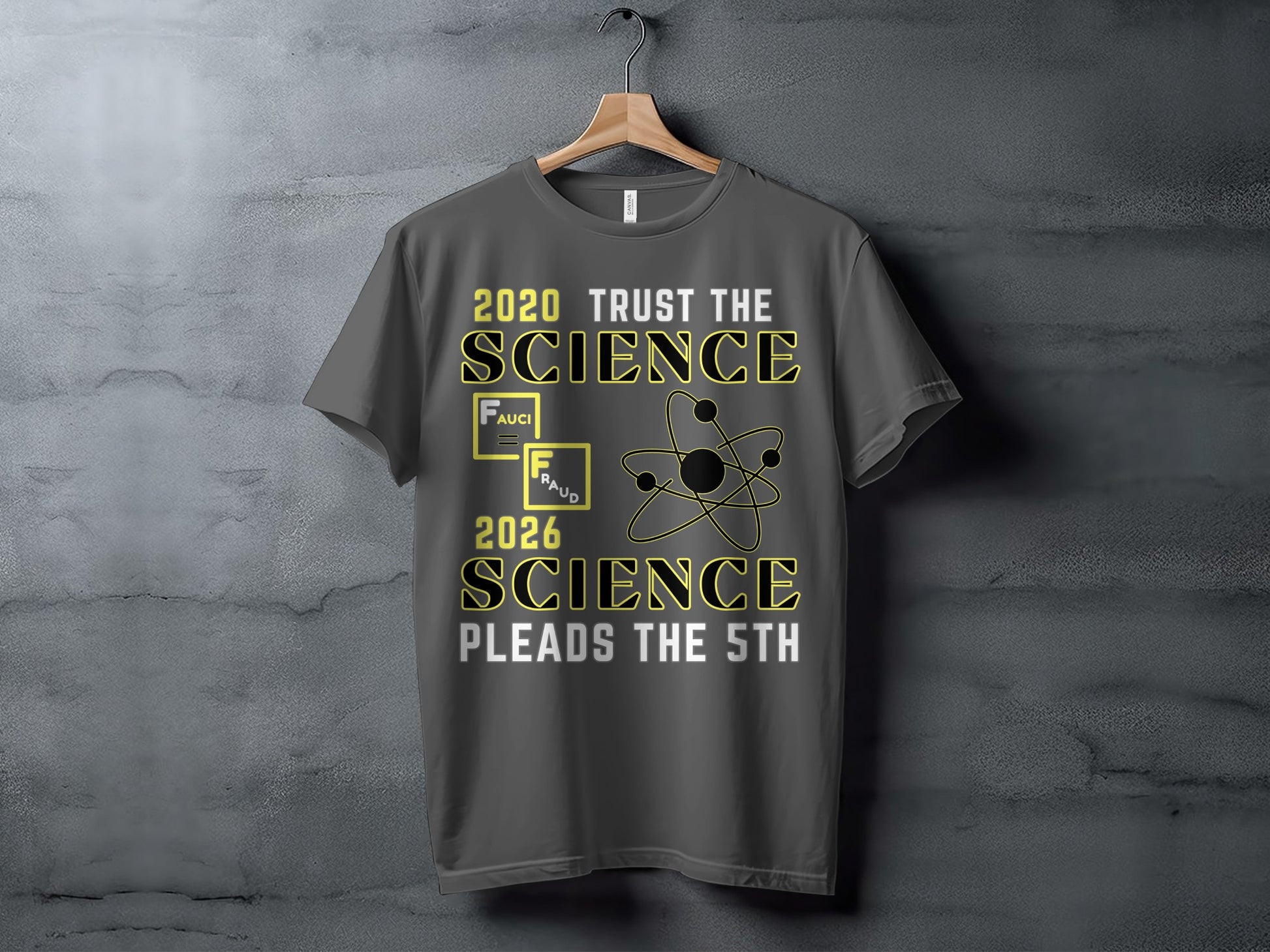 Dark grey t-shirt with text "2020 Trust the Science" and atom graphic.