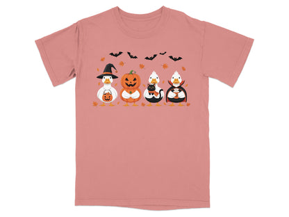 Ducks in Halloween costumes: witch, pumpkin, black cat, and vampire with bats and leaves.
