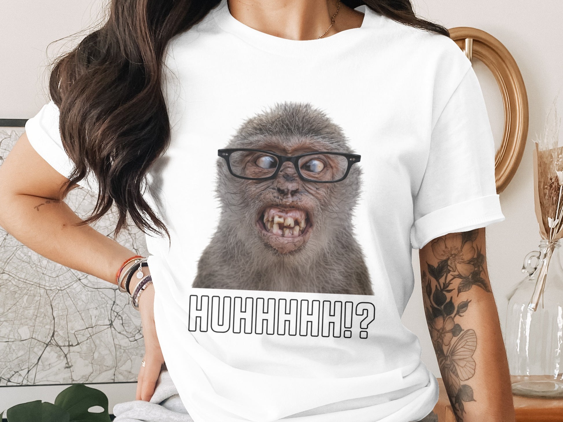 White t-shirt with a close-up of a monkey wearing glasses and the text "HUHHHHH!?"