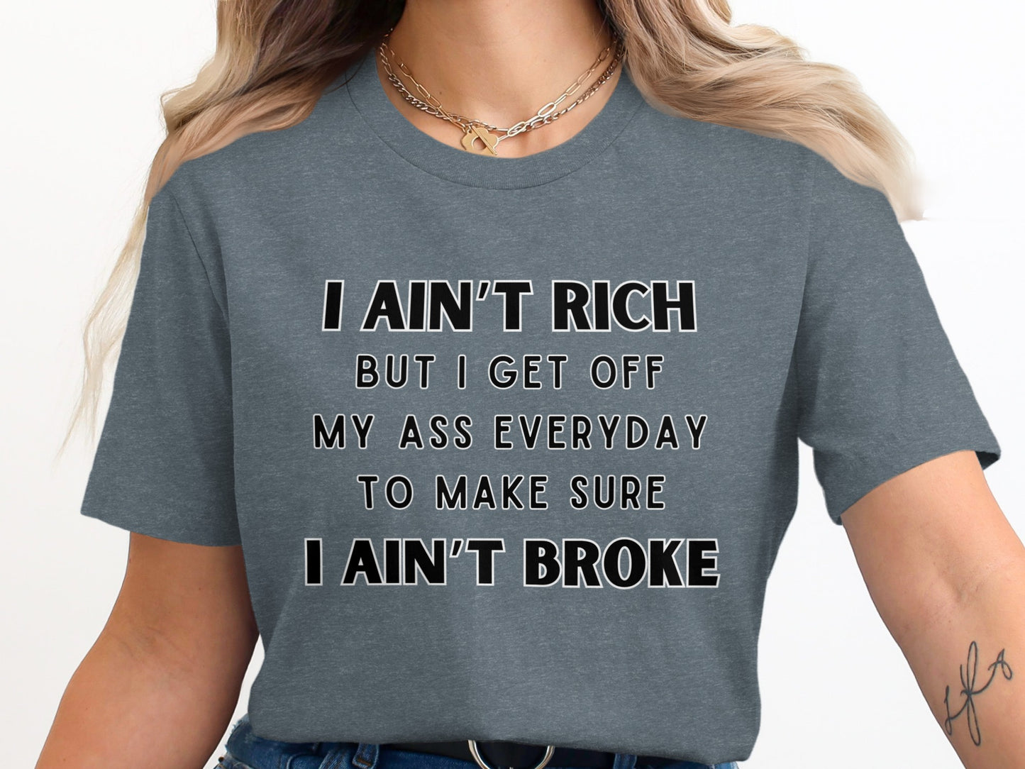 Gray t-shirt with white text "I ain't rich but I get off my ass everyday to make sure I ain't broke."