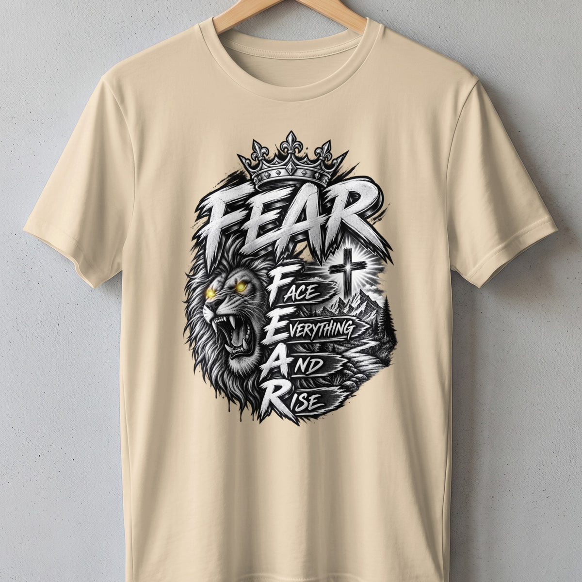 Lion with crown and text "FEAR FACE EVERYTHING AND RISE" with cross and mountains.