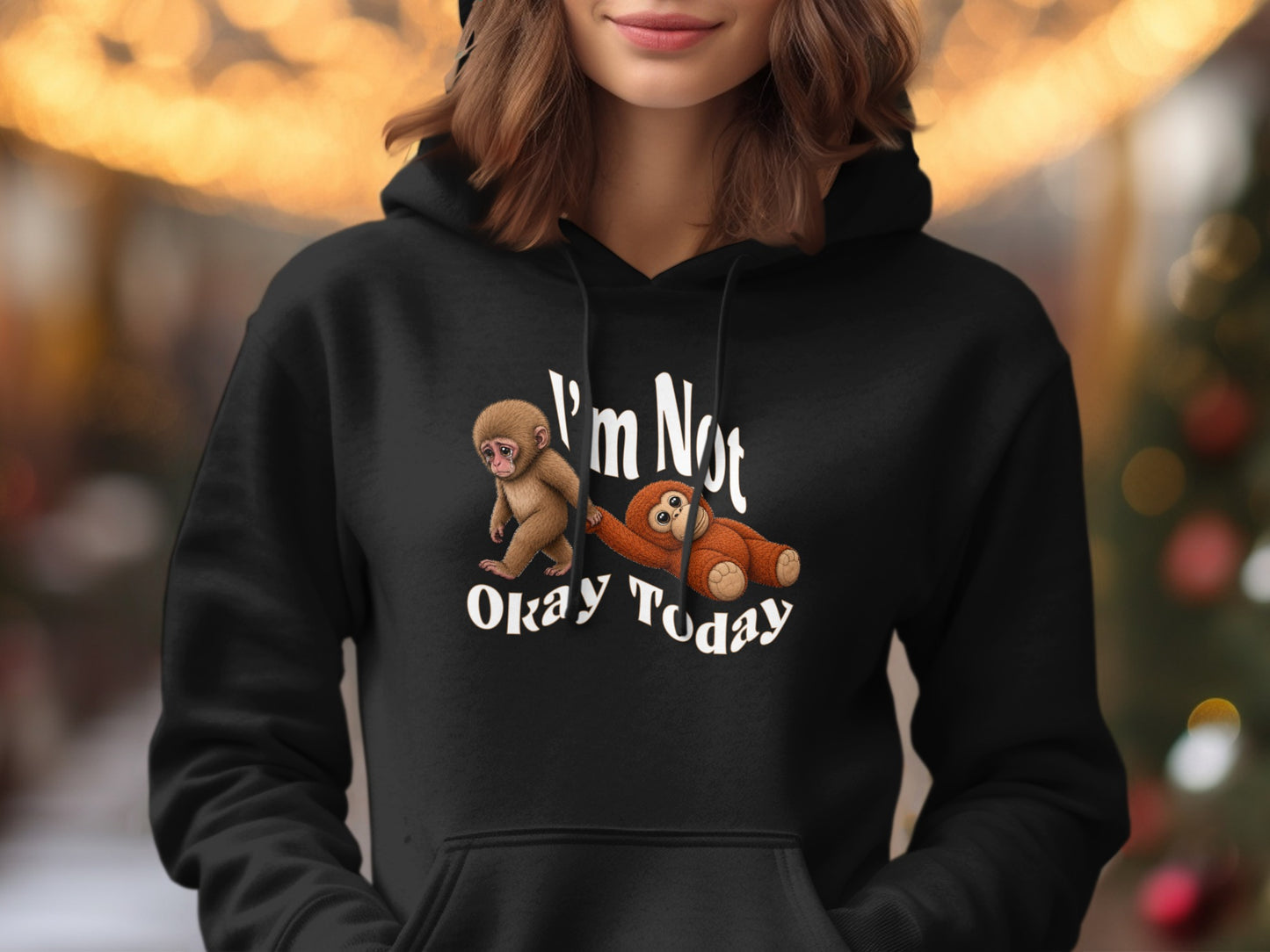 Black hoodie with graphic of monkeys and text "I'm Not Okay Today".