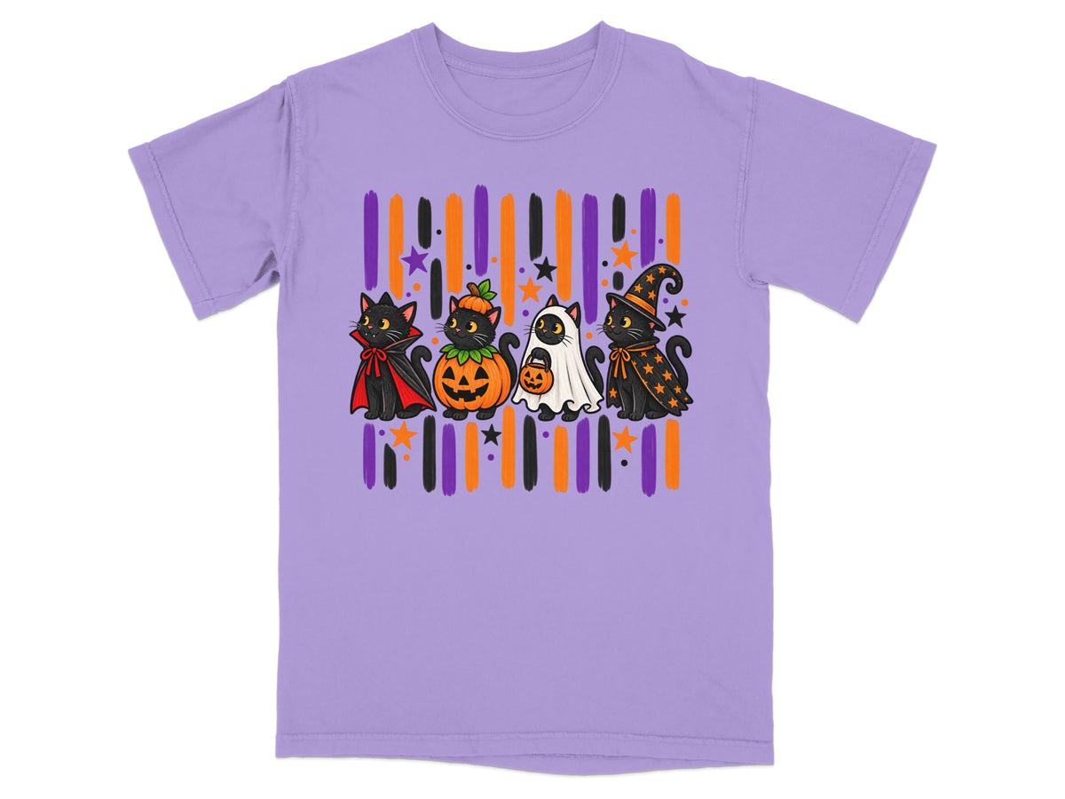 Four black cats in Halloween costumes stand in front of striped background on purple t-shirt.