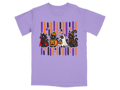 Four black cats in Halloween costumes stand in front of striped background on purple t-shirt.